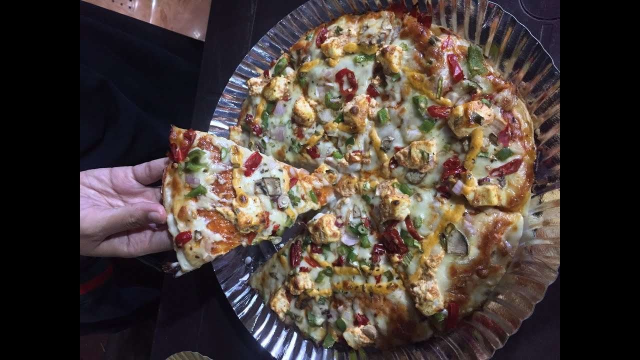 paneer paprika cheeseburst pizza by dens pizza, surat