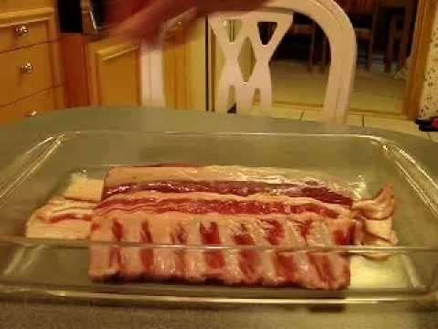 Rack of Lamb Crusted with Garlic, Spanish Paprika and Rye Topping wrapped in Bacon