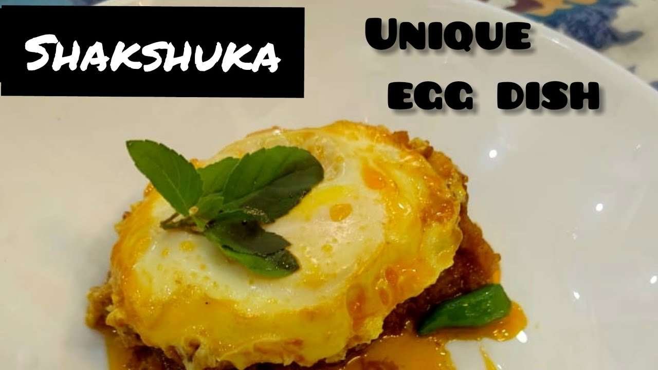 shakshuka.eggs poached in spicy tomato sauce. best breakfast recipe with eggs.AKA egg and tomato