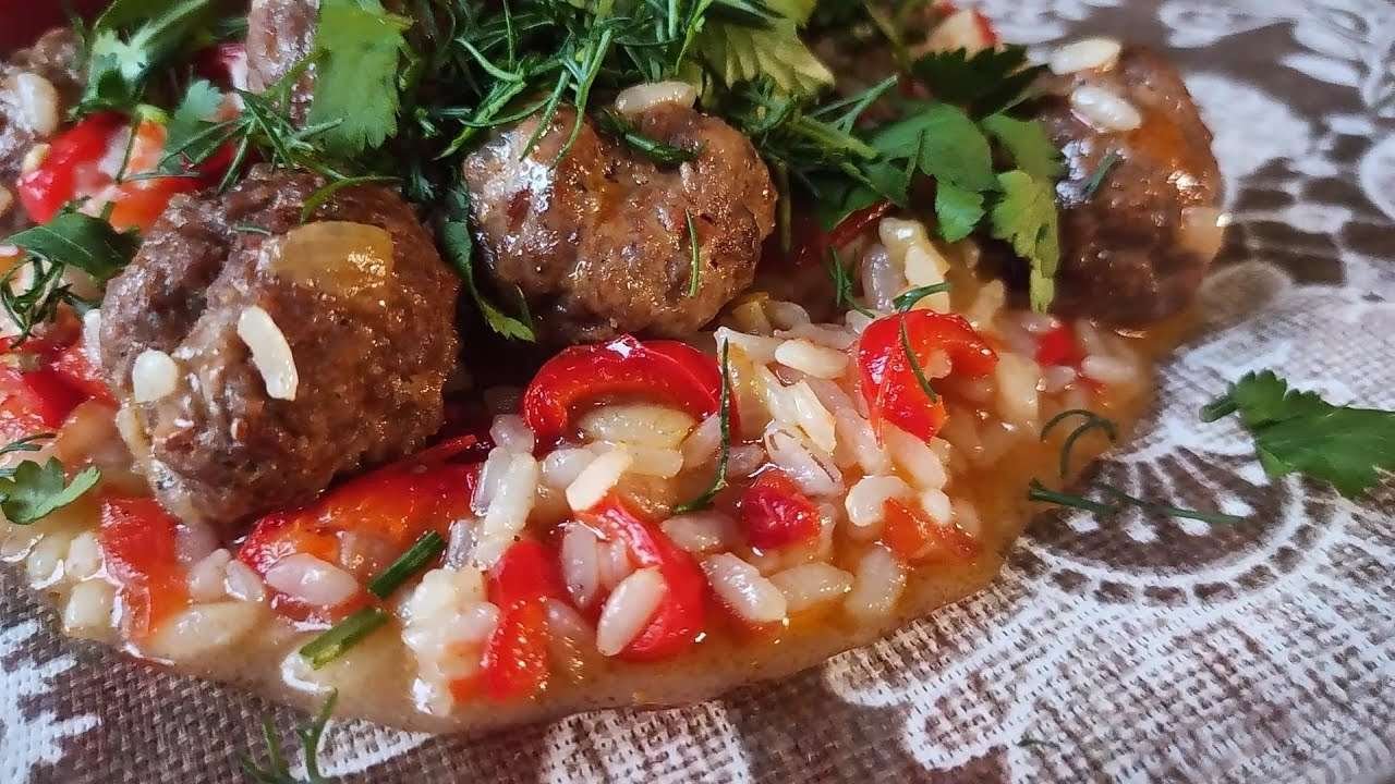 Rice with meat balls  in a frying pan