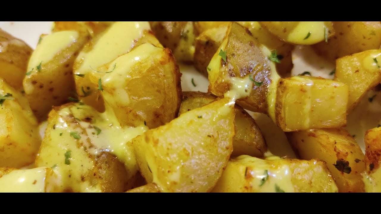 Spicy Patatas Bravas with just a tinge of Garlic Aioli. ( Patatas Bravas con Alioli de Ajo)