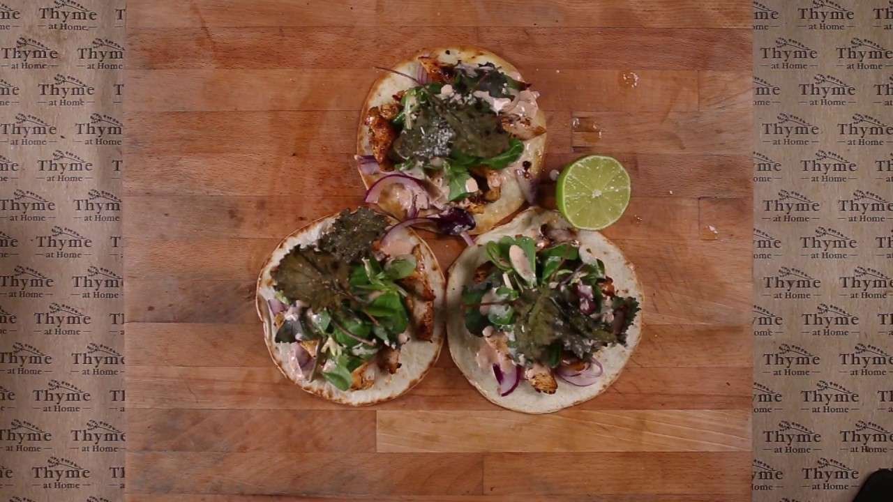 Spicy Chicken Tostado with Crispy Kale and Lime Paprika Mayo.