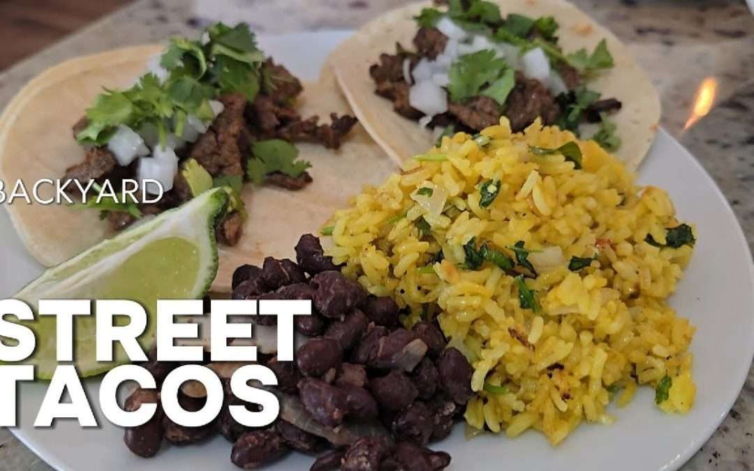 Griddle-seared street tacos,zesty cilantro lime jasmine-yellow rice, and seasoned black beans